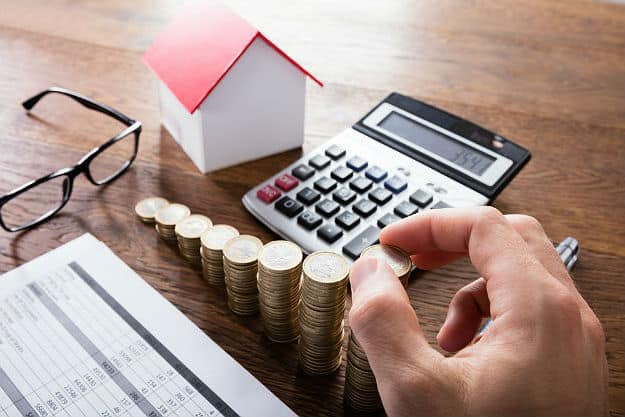 calculators and coins | What Is Property Tax?