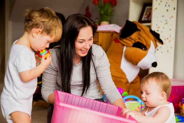 woman and babies playing | How to Use Nanny Tax Calculator? | nanny tax calculator