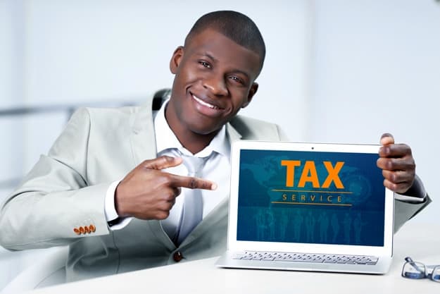 african man showing laptop | Is Online Tax Preparation Safe? | online tax preparation