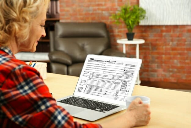 senior woman using laptop | What To Expect From Tax Relief Center This 2018
