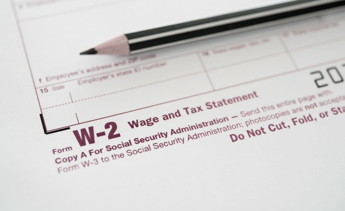 w2 form and pencil | What Tax Forms Do I Need for a New Employee? | new employee forms | tax paperwork for new employee