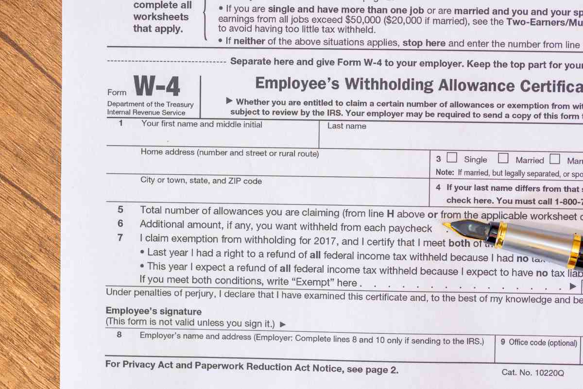 w4 form and pen | What Tax Forms Do I Need for a New Employee? | new employee forms | new employee tax forms