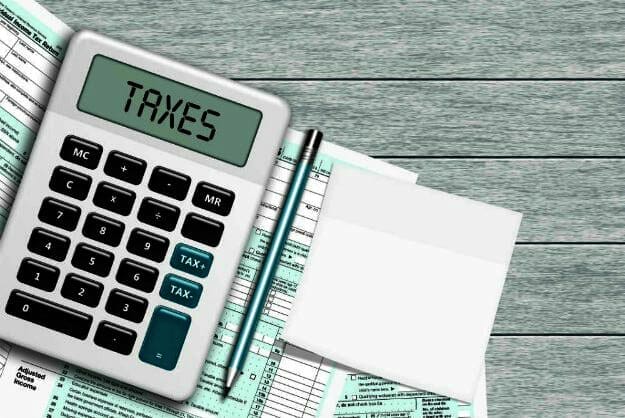 tax written on calculator | How To Estimate Taxes This Year