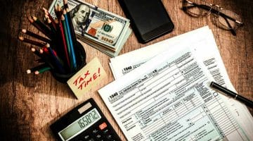 Feature | tax time form money on table | Tax Help and FAQs | What Taxpayers Need to Know | Tax Relief Center | tax help