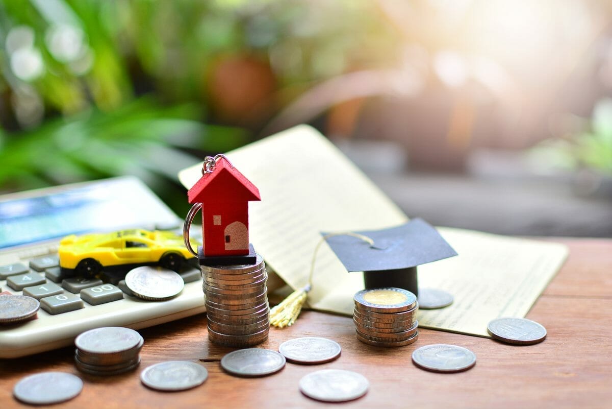 coins and calculator on a table | Tax Preparation Checklist To Take Control Of Your Tax Planning Early This Year