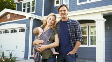 Featured | Portrait Of Family Standing Outside House | Tax Deductions For Homeowners