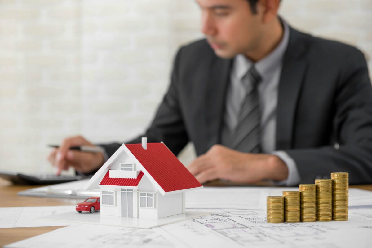 Businessman as a property agent or investor calculating growth | How To Write Off Taxes On Rental Property | Rental Property Tax Write Offs