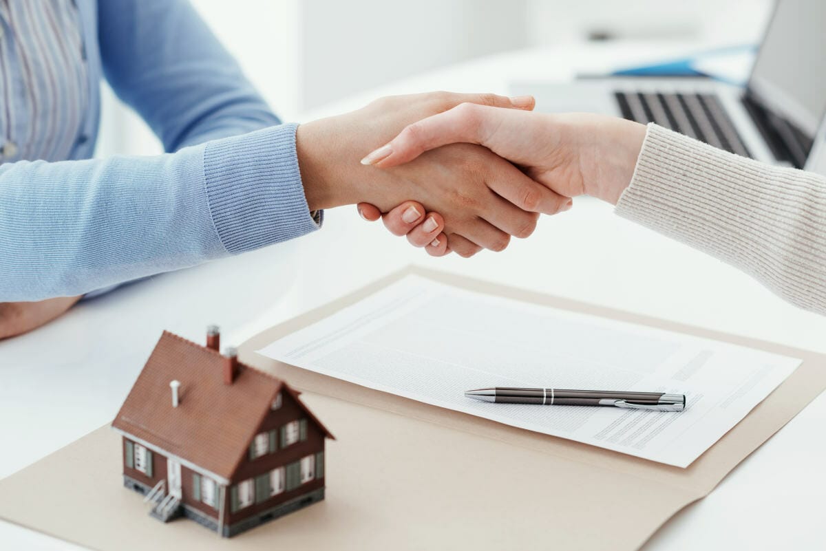 Real estate broker and customer shaking hands after signing a contract | What Are The Most Common Tax Deductions? | Tax Relief Center | list of tax deductions