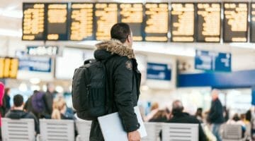 Feature | man on airport | Surprising Deductible Tax Items | Vacations Tax Deductible | vacations tax deductible