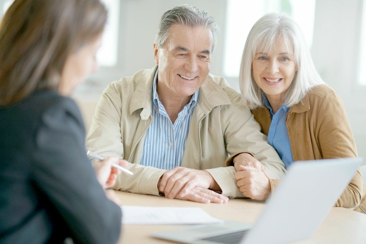senior couple meeting with financial adviser | What Is Financial Planning? Frequently Asked Questions [And Answers!] | financial security