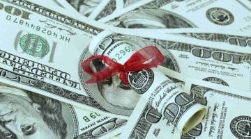 Feature | gift money red ribbon | IRS Rules On Gifts | gift tax