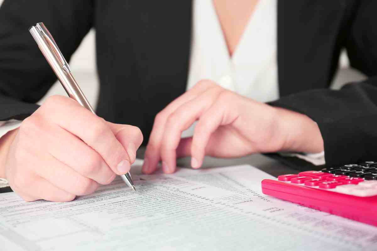 businesswoman filling individual income tax return | IRS Installment Agreement Types | How Can It Help You | Installment plan