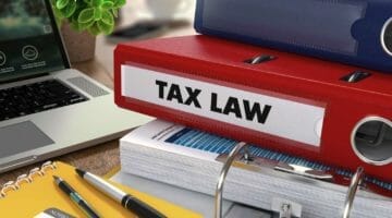 Feature | red binder and files | What's The Penalty For Filing Taxes Late? | penalty for filing taxes late