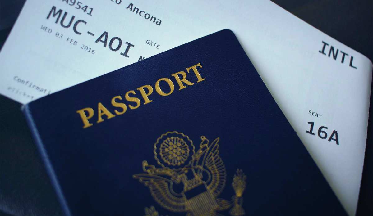 Passport booklet on top of white paper | Different Types Of Taxes We Pay In The US | taxes