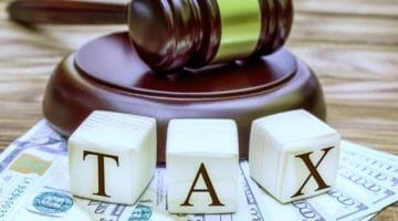 Feature | tax blocks gavel and money | Tax Penalty For Underpayment [2019 Edition] | Tax Relief Center | irs penalty