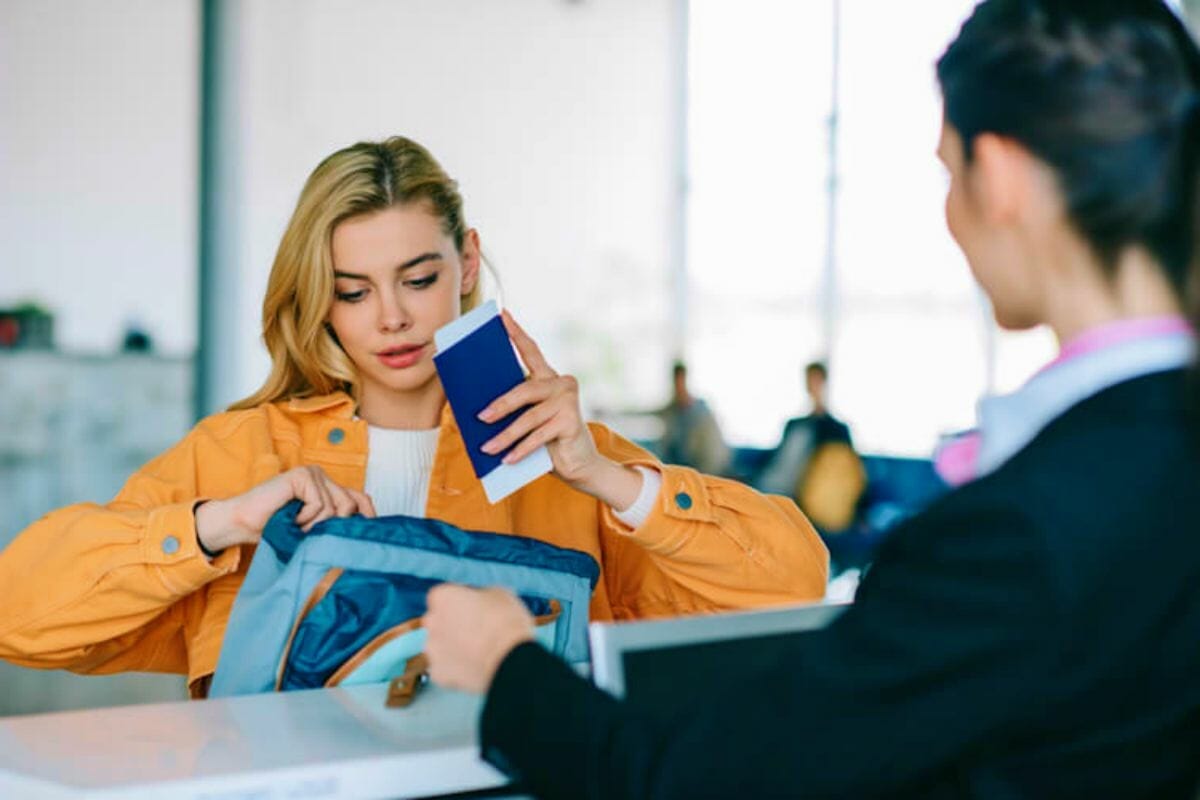 A woman checks in at the airport with her passport | Types Of IRS Letters And Notices And What They Mean