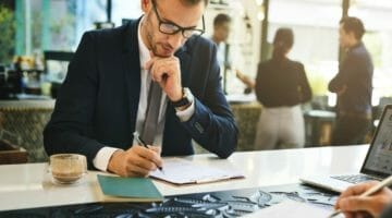 Feature | businessman filling out form | How To Fill Out The IRS Offer In Compromise Form 656 | irs form 656