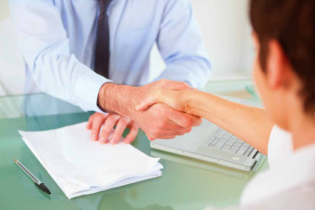 business person handshake | Reasons To Speak To A Tax Relief Specialist About Your Back Taxes ASAP | tax debt relief