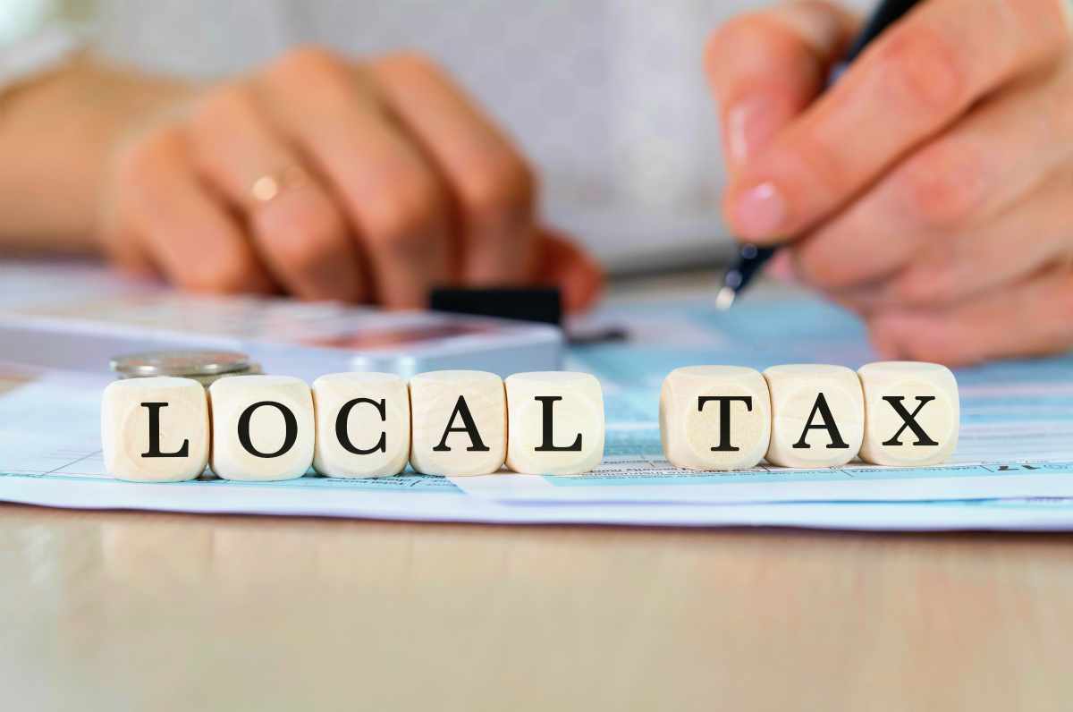 local tax word on blocks | Reasons To Speak To A Tax Relief Specialist About Your Back Taxes ASAP | tax debt relief