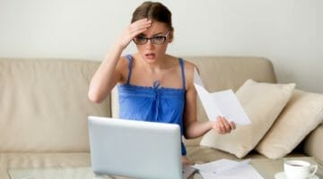 Feature | woman worried about her bills | What to Do When You Can't Make This Month's IRS Installment Payment | irs installment agreement
