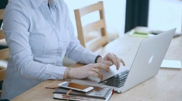 Feature | woman using laptop | A Guide To Estimated Taxes For Small Business Owners | estimated tax payments