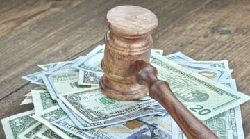 Feature | money and gavel | IRS Penalties: Tax Evasion, Tax Fraud, And Other Tax Crimes | irs penalties