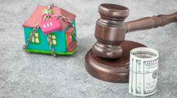 Feature | gavel mini house and money | Can You Stop The IRS Seizure Of Property? | can the irs take my home