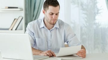 Featured | man reading documents | What To Do If You Have Unfiled Tax Returns | unfiled tax returns statute of limitations
