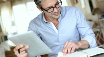 Featured | businessman working at home | Bad Debt Expenses: What Is It And How To Write It Off | bad debt expense | what is bad debt expense